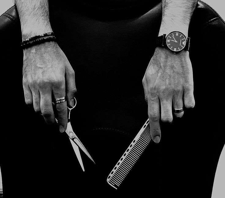 Barber giving a precision haircut at L.A. Men's Grooming Room in Hampton Bays, NY
